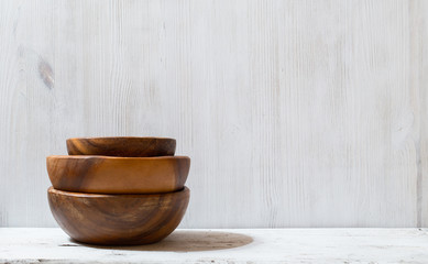 wooden bowls on white table