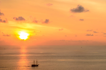 Beautiful sunset with boat seen from Promthep cape in Phuket Thailand
