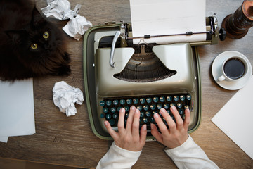 Vintage typewriter and white paper