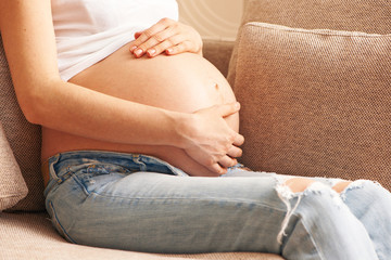 Fototapeta na wymiar Pregnant woman at home