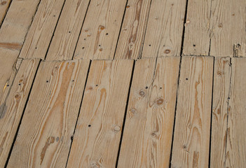 Fototapeta premium Vintage wooden surface with planks and gaps in perspective