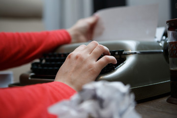woman working on typewriter