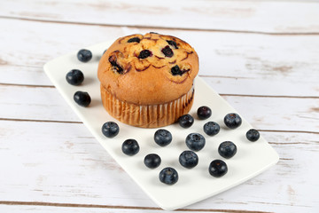 Blueberries muffin on wooden background