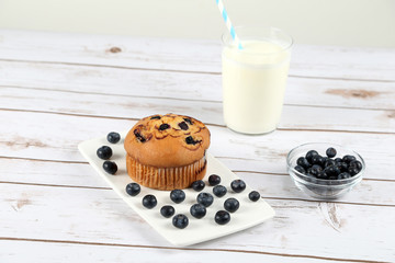 Blueberries muffin on wooden background