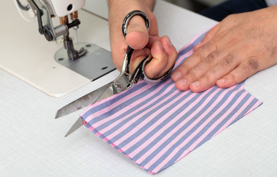 cutting fabric with scissors