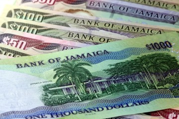Assorted Jamaican money banknotes - Financial security concept background