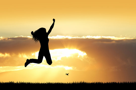 girl jumping at sunset