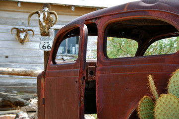 Abandoned old car on route 66 road in USA