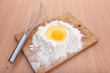Egg white and yolk in floor on kitchen table