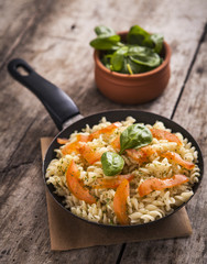 Whole wheat pasta with vegetables on cast iron pan