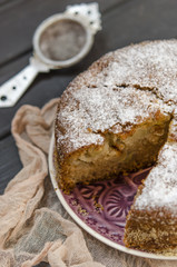 Apple charlotte with semolina topped with powdered sugar   