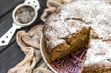 Apple charlotte with semolina topped with powdered sugar   