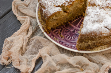 Apple charlotte with semolina topped with powdered sugar   