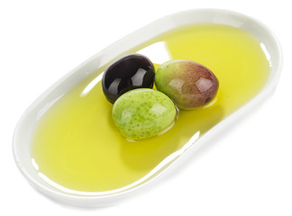 Variety of olives in pocelain dish isolated on white background.