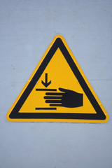 Aufkleber mit dem Symbol Achtung Klemmgefahr