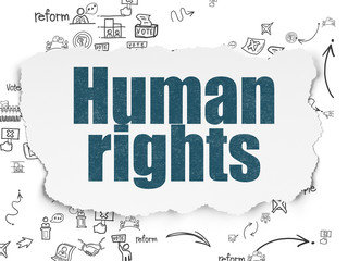 Political concept: Human Rights on Torn Paper background