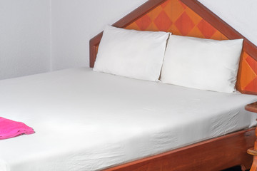 White bed/White pillows on comfortable soft white bed.