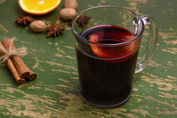 Mulled wine, punch and spices for glintwine on vintage wooden background