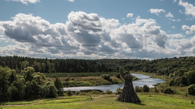 Art object Lighthouse on Cumulus clouds backgroung, timelapse