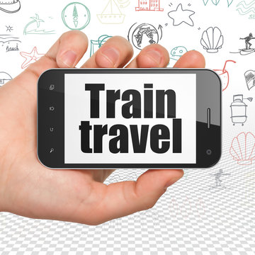 Vacation concept: Hand Holding Smartphone with Train Travel on display