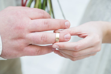 Obraz na płótnie Canvas wedding ceremony, wedding rings and hands