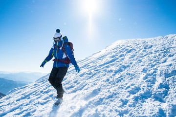 woman descending from snowy mountains