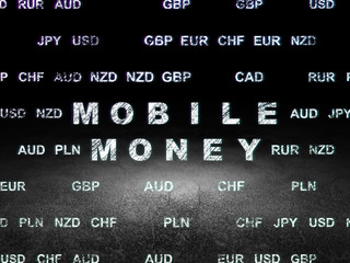 Currency concept: Mobile Money in grunge dark room