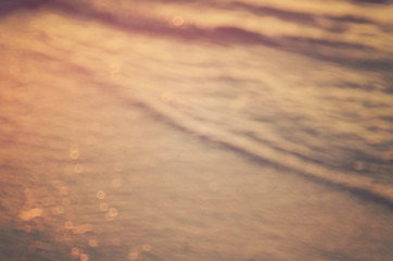 Fototapeta na wymiar Blur beach with bokeh sun light abstract background.