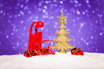christmas ornament in snow on glitter background