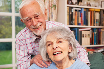 Affectionate Senior Couple At Home Together