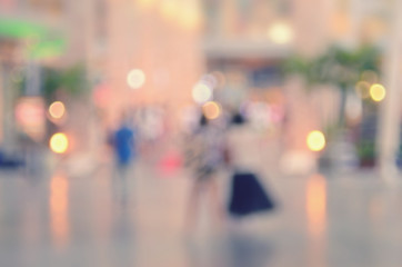 Blur people walking in shopping center mall abstract background.