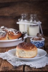 Homemade glazed cinnabons with cinnamon and almonds, american kitchen. .