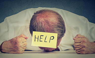 Tired, stressed senior employee needs help