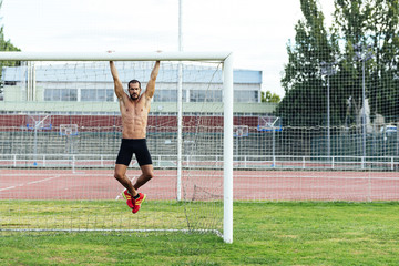 Obraz premium Man Doing Chin-ups outdoor.