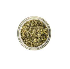 Dried Japanese green tea leaves in mason jar over white background