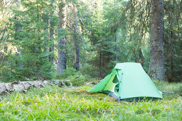 Green tent on mountain top, Retezat mountains, Romania