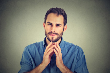 Sneaky scheming young man, worker trying to plot something