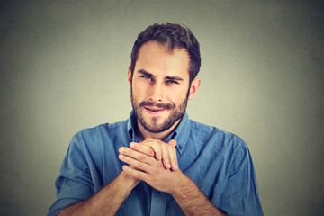 Sneaky scheming young man, worker trying to plot something