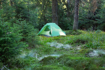 Green tent on mountain top, Retezat mountains, Romania