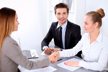 Business people shaking hands, finishing up a meeting