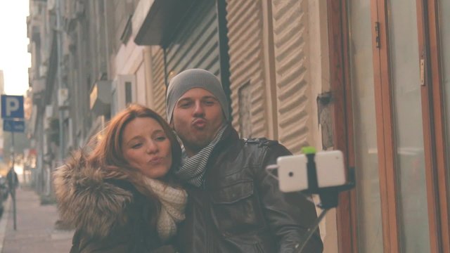 Couple doing selfie outdoors.
