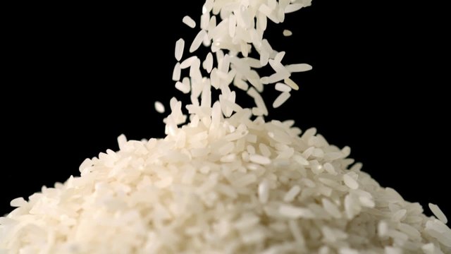 Pouring rice into plate shooting with high speed camera.
