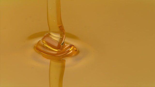 Honey pouring on honey shooting with high speed camera.