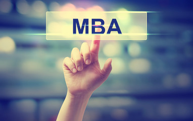 MBA concept with hand pressing a button