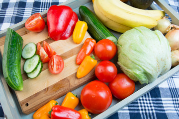 Fruits and vehetables on a blue tray