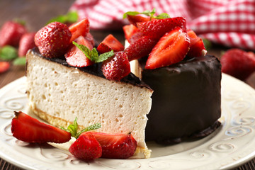Delicious cheesecake with berries on table close up