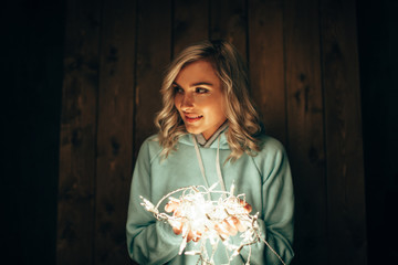 woman holding electric garland