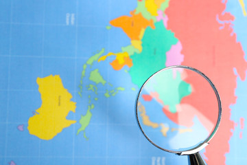 World map with magnifying glass. Worldly cuisine concept