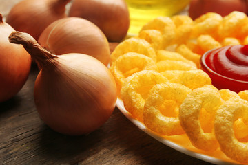 Chips rings with sauce on plate closeup