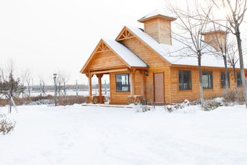 Wooden house in the snow